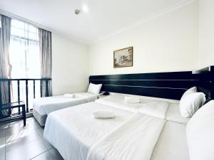 Postel nebo postele na pokoji v ubytování Asphodel Inn