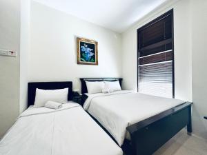 Letto o letti in una camera di Asphodel Inn