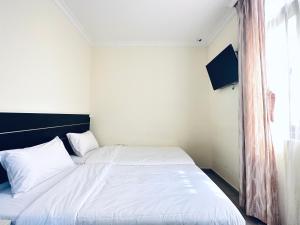 Letto o letti in una camera di Asphodel Inn