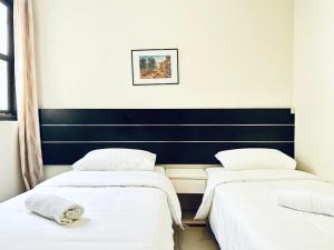 Letto o letti in una camera di Asphodel Inn