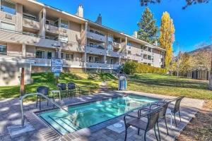 a swimming pool in front of a building at Our Happy Place home in South Lake Tahoe