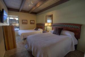 a hotel room with two beds and a mirror at Our Happy Place home in South Lake Tahoe +67 photos