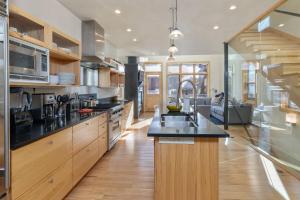 a large kitchen with wooden cabinets and a counter top at West Pacific Ave 320 ~ Pacifico in Telluride