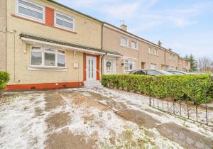 an empty parking lot in front of a house at West End House by Klass Living Bellshill in Bellshill