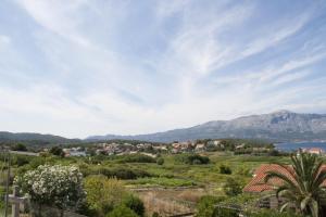 a view of a town with mountains in the background at House Baglija in Lumbarda