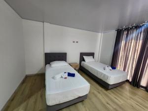 Postel nebo postele na pokoji v ubytování Hotel nelumbo