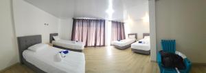 Postel nebo postele na pokoji v ubytování Hotel nelumbo