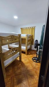 a room with two bunk beds and a camera at Casa familiar barranco in Barranquilla