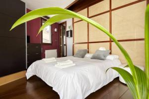 מיטה או מיטות בחדר ב-Casa del Álamo