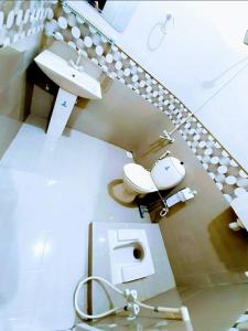 Vonios kambarys apgyvendinimo įstaigoje Guest House Galaxy Inn