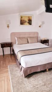Postel nebo postele na pokoji v ubytování Hotel Dandy Rouen centre