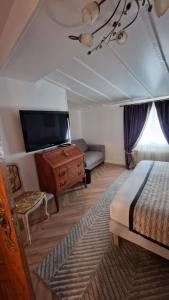 Postel nebo postele na pokoji v ubytování Hotel Dandy Rouen centre