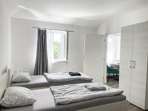 Posteľ alebo postele v izbe v ubytovaní Apartmány Plzeň Zábělá 69