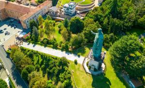 an aerial view of a statue in a park at Villa San Carlo in Arona
