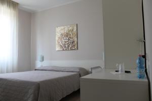 Cama o camas de una habitación en Hotel Cremona Viale