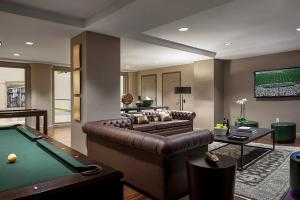 a living room with a pool table and a couch at Back Bay 1br w gym wd close to garden BOS-942 in Boston