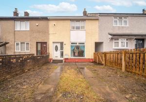 a house with a wooden fence in front of it at Rothesay House by Klass Living Coatbridge in Coatbridge