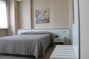 Postel nebo postele na pokoji v ubytování Hotel Cremona Viale + 68 fotografií