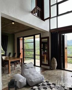a living room with a couch and a table at 11 House Mae rim by Kohei in Mae Rim