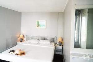 Postel nebo postele na pokoji v ubytování Fulay Guesthouse Hua Hin