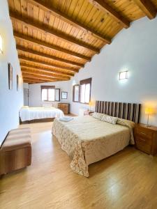 מיטה או מיטות בחדר ב-Casa Gañan
