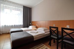 Posteľ alebo postele v izbe v ubytovaní Hotel Gracja