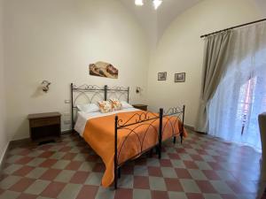 Posteľ alebo postele v izbe v ubytovaní B&B Palazzo Tornabene