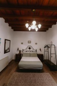 a bedroom with a bed and a ceiling at One & Lux Casa Maravilla in Seville