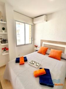 Postel nebo postele na pokoji v ubytování APARTBEACH ADRIATICO 518 VISTAS PLAYA y CLIMATIZADO