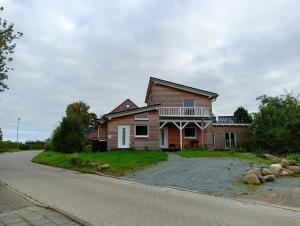 a house on the side of a road at Ferienwohnung Blaue Sonne Devin in Stralsund