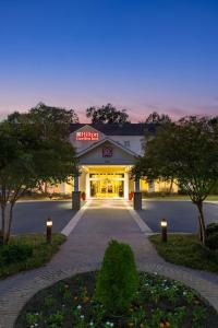 a building with a sign on the front of it at Hilton Garden Inn Montgomery East in Montgomery