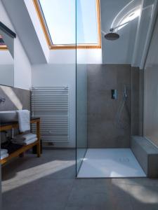 a bathroom with a shower with a glass door at Hotel Belmur in Murska Sobota +85 photos