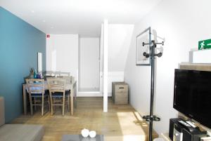 TV a/nebo společenská místnost v ubytování B&B Het Schaliënhof