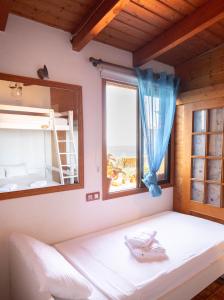 Cama ou camas em um quarto em Casanaga