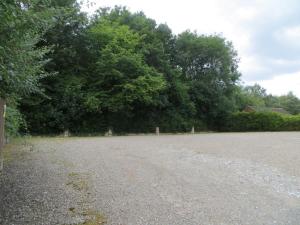 an empty parking lot with trees in the background at Bridgnorth 24 Hour Self Check In with FREE Parking in Bridgnorth