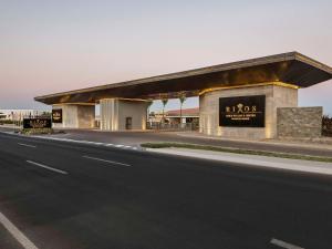 a building on the side of a road at Rixos Golf Villas And Suites Sharm El Sheikh in Sharm El Sheikh