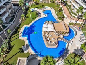 an overhead view of a swimming pool at a resort at Lovely first floor apartment, heating pool ! in Playa Flamenca