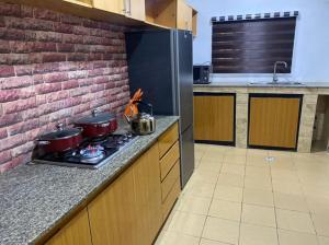 a kitchen with pots and pans on a stove at Christmas Promo-Time in Wupa