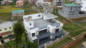 an aerial view of a white house at Ampifitia Guest House in Antananarivo