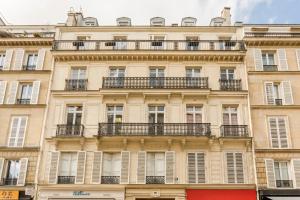 a building with balconies on the side of it at Cocoon Loft - Champs-Elysées in Paris