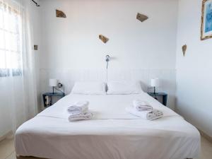 Cama ou camas em um quarto em Casanaga