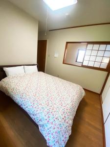 Postel nebo postele na pokoji v ubytování シークレットベースゆふいん