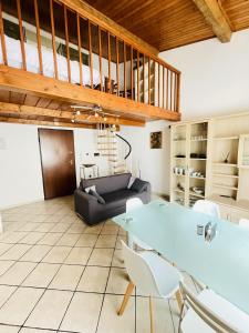 a living room with a table and a couch at JacuzziSuite in Livorno