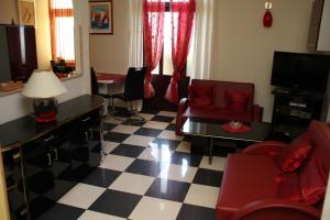 a living room with a checkered floor at Apartments Mia in Podgora