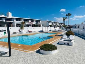 a large swimming pool in a large building at Los Marinos 36 in Puerto del Carmen