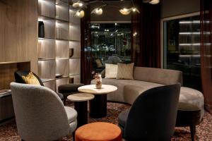 a living room with a couch and chairs and a table at Quality Hotel Saga in Troms&oslash;