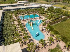 an overhead view of a pool at a resort at Caretta Island in Kalamaki