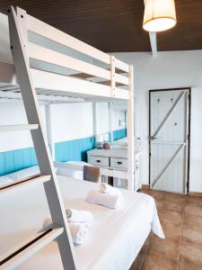 Cama ou camas em um quarto em Casanaga