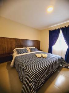 Postel nebo postele na pokoji v ubytování Hotel Villa