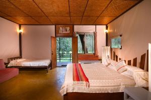 Postel nebo postele na pokoji v ubytování Jungle Hut